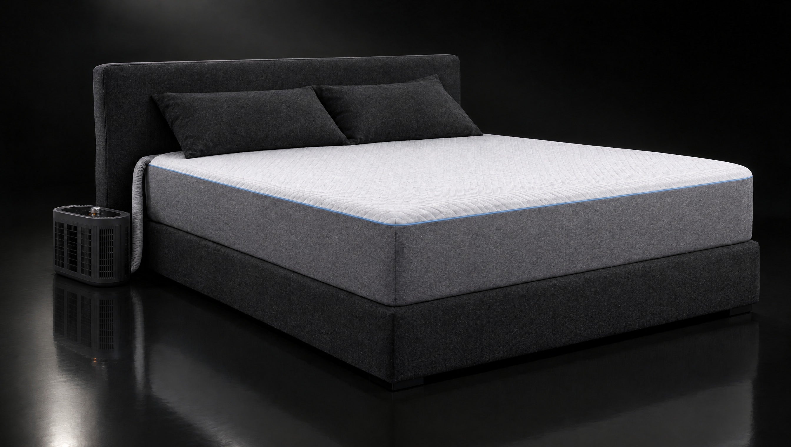 AuraSnooze cover on a bed with the control unit beside it