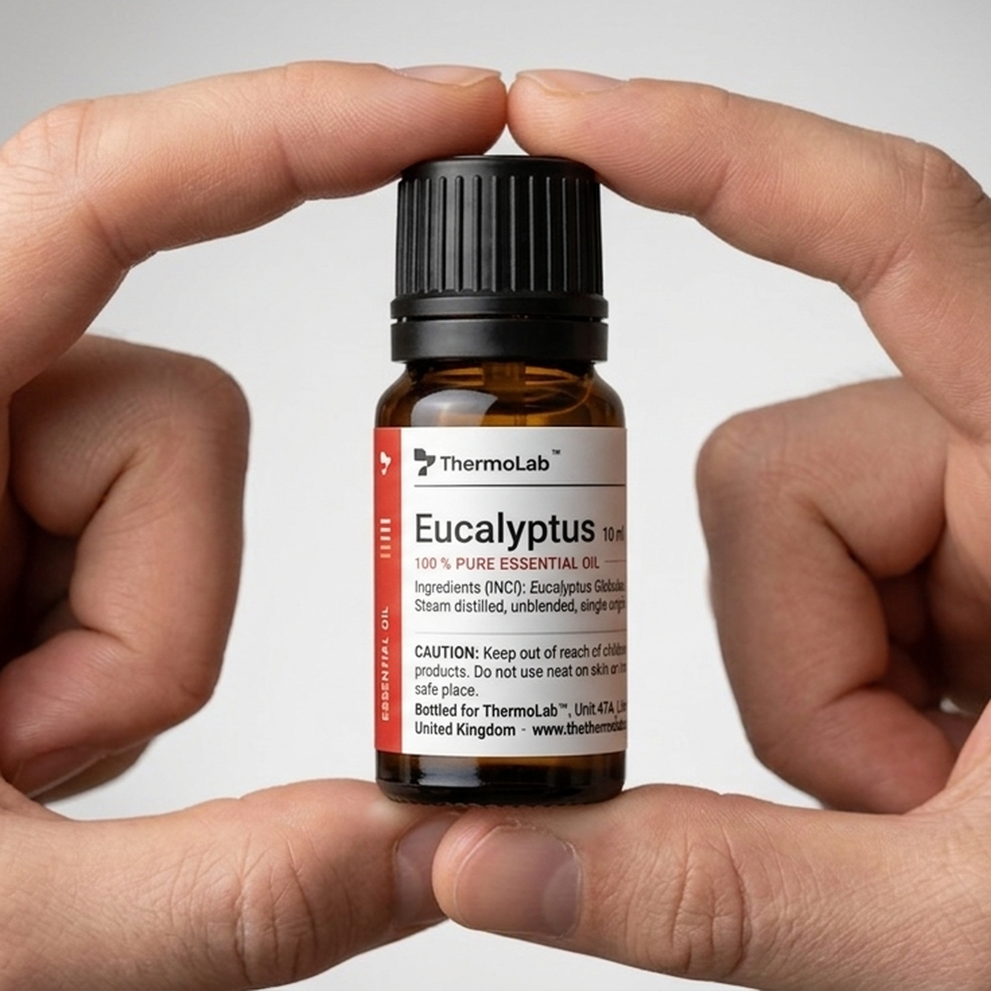 Hands holding the 10ml ThermoLab eucalyptus oil bottle to show its size