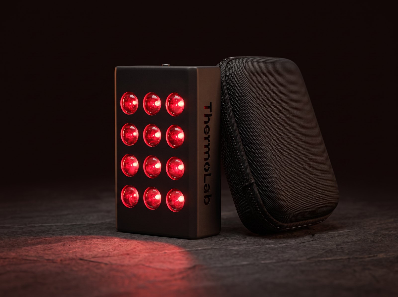 ThermoLab Aura Mini glowing beside its travel case